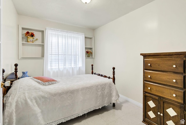 bedroom with baseboards