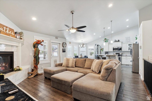 1254 N 150 E, Harrisville, UT 84404 - living area featuring a ceiling fan, a tile fireplace, dark wood-style floors, a chandelier, and recessed lighting