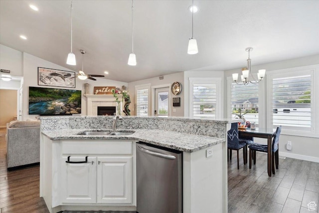 1254 N 150 E, Harrisville, UT 84404 - kitchen featuring dishwasher, open floor plan, a sink, a warm lit fireplace, and lofted ceiling