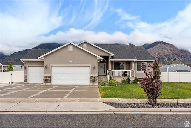 1254 N 150 E, Harrisville, UT 84404 - view of front facade with stucco siding, a mountain view, an attached garage, and stone siding