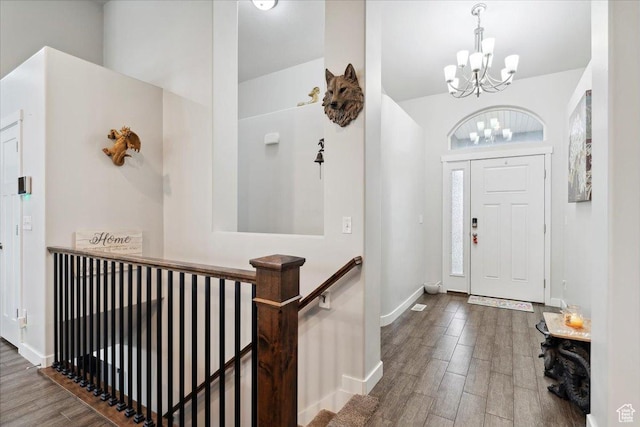 1254 N 150 E, Harrisville, UT 84404 - entryway featuring a chandelier, wood finished floors, and baseboards