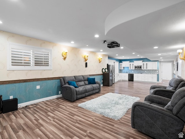 3388 W Rocky Peak Way S, Jordan, UT 84095 - living area with light wood-style floors, recessed lighting, wallpapered walls, a wainscoted wall, and baseboards