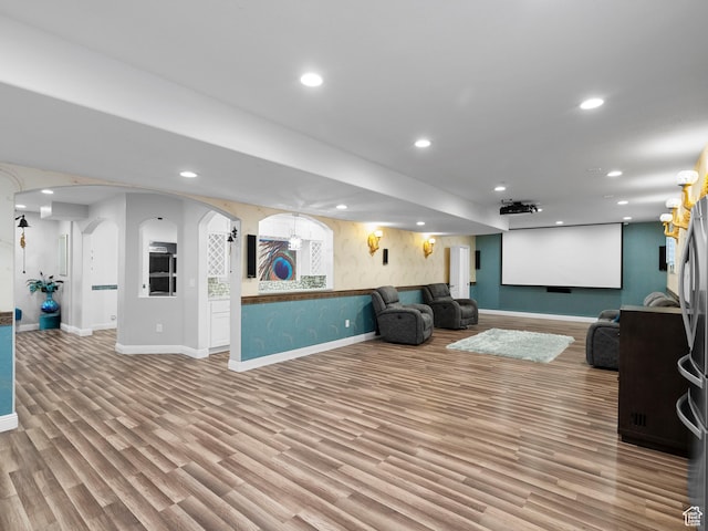 3388 W Rocky Peak Way S, Jordan, UT 84095 - cinema room with arched walkways, recessed lighting, wood finished floors, and baseboards