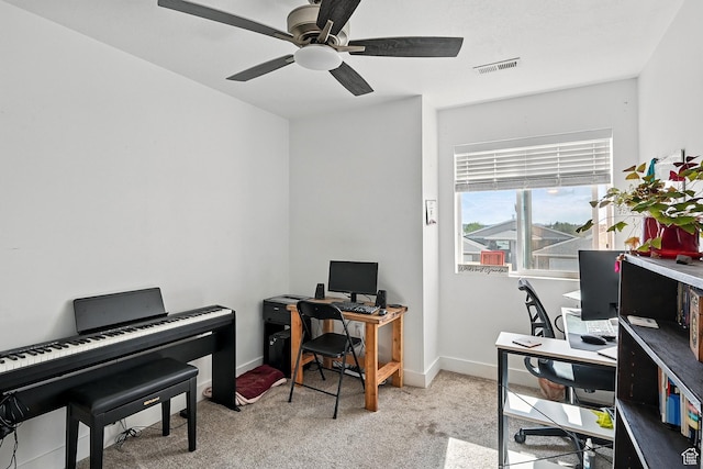 office space with ceiling fan, carpet, and baseboards
