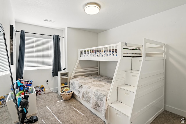 bedroom with carpet and baseboards