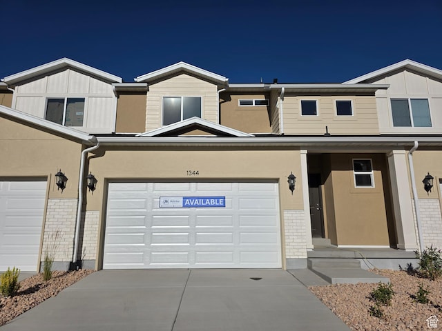 1334 N 1400 E Unit 03-09, Payson, UT 84651 - traditional home featuring brick siding, driveway, and board and batten siding