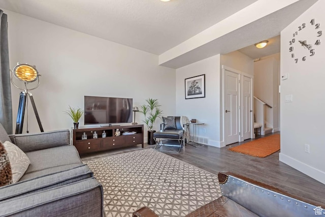 living area featuring wood finished floors and baseboards