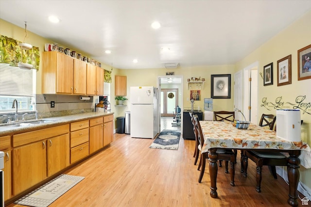 3426 S 500 E, South Salt Lake, UT 84106 - kitchen with freestanding refrigerator, a sink, light wood-type flooring, light countertops, and recessed lighting