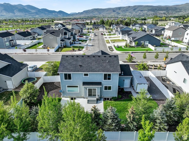 aerial perspective of suburban area with a mountainous background