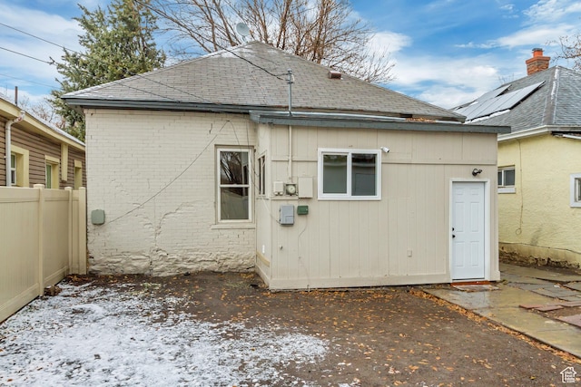 915 W 300 S, Salt Lake City, UT 84104 - back of property featuring a shingled roof, fence, and a patio area