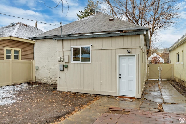 915 W 300 S, Salt Lake City, UT 84104 - back of property with a shingled roof, a gate, fence, and a patio area