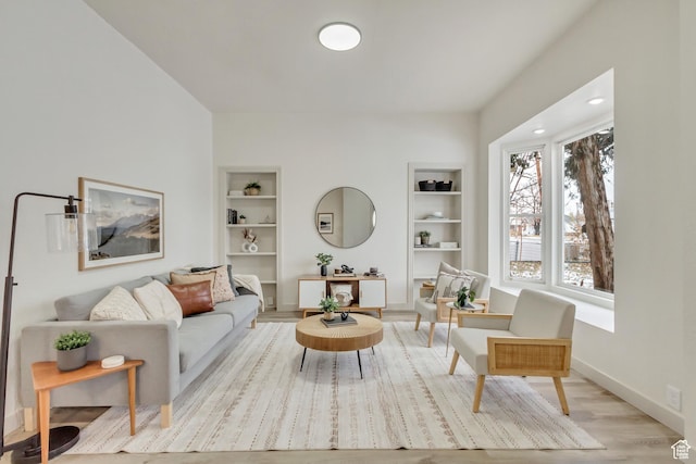 915 W 300 S, Salt Lake City, UT 84104 - living area featuring built in features, wood finished floors, and baseboards