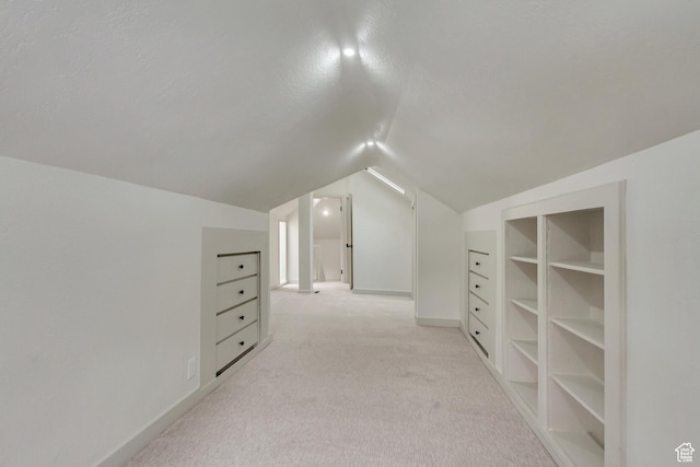 915 W 300 S, Salt Lake City, UT 84104 - additional living space with lofted ceiling, light carpet, and baseboards