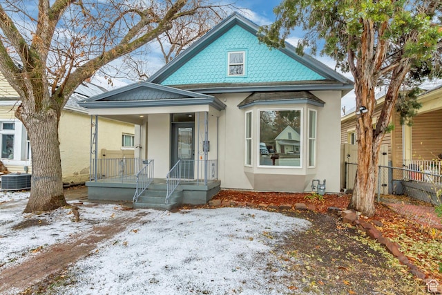 915 W 300 S, Salt Lake City, UT 84104 - victorian home featuring cooling unit, stucco siding, and fence