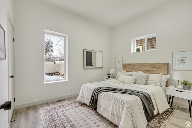 915 W 300 S, Salt Lake City, UT 84104 - bedroom featuring light wood-style floors and baseboards