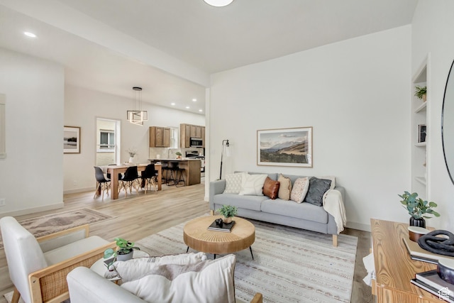 915 W 300 S, Salt Lake City, UT 84104 - living area with light wood-style floors, recessed lighting, built in shelves, and baseboards