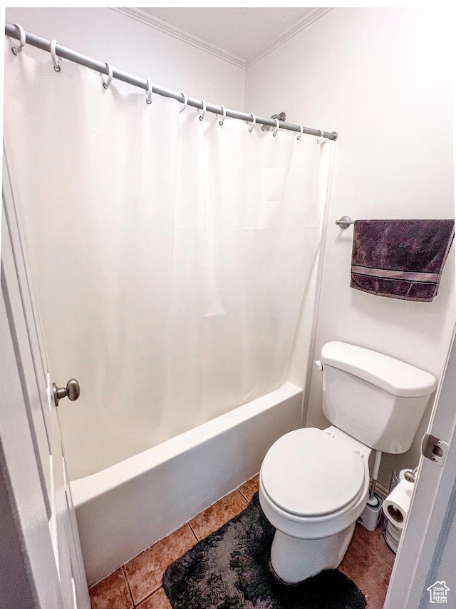 bathroom featuring ornamental molding, toilet, shower / bath combination with curtain, and tile patterned flooring