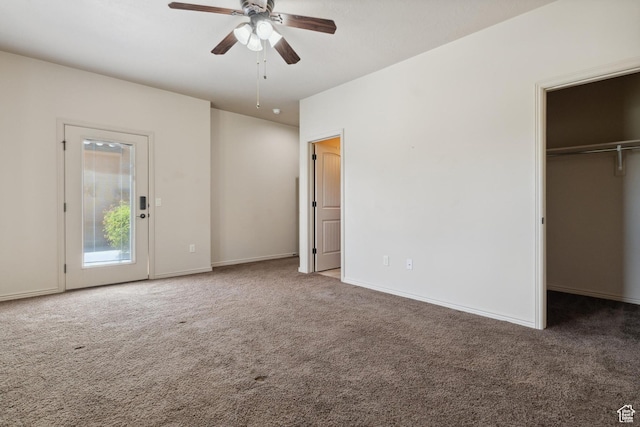 417 E Stonehedge Cir, Washington, UT 84780 - unfurnished bedroom with carpet flooring, a spacious closet, baseboards, ceiling fan, and a closet