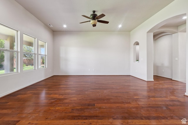 417 E Stonehedge Cir, Washington, UT 84780 - empty room with ceiling fan, arched walkways, wood finished floors, recessed lighting, and baseboards