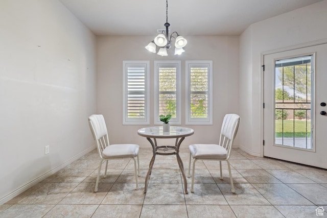 417 E Stonehedge Cir, Washington, UT 84780 - dining area featuring a chandelier, light tile patterned floors, and baseboards