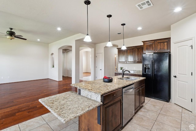 417 E Stonehedge Cir, Washington, UT 84780 - kitchen featuring black refrigerator with ice dispenser, stainless steel dishwasher, a sink, a ceiling fan, and arched walkways