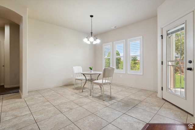 417 E Stonehedge Cir, Washington, UT 84780 - dining room featuring plenty of natural light, light tile patterned floors, arched walkways, and baseboards