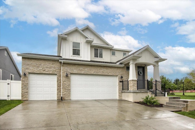 352 N 75 E, Kaysville, UT 84037 - view of front of house with board and batten siding, stone siding, driveway, and an attached garage
