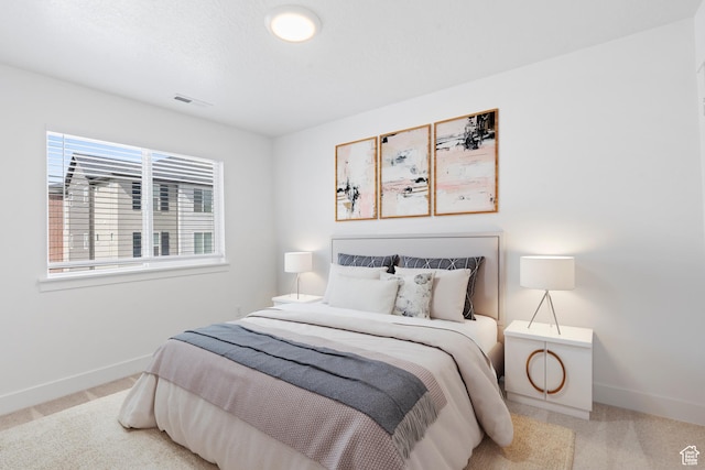 bedroom featuring carpet flooring and baseboards