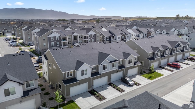 aerial perspective of suburban area featuring a mountainous background