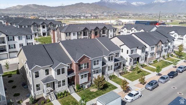 aerial view of residential area featuring a mountainous background