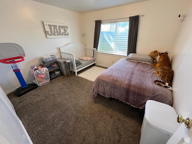 carpeted bedroom with baseboards