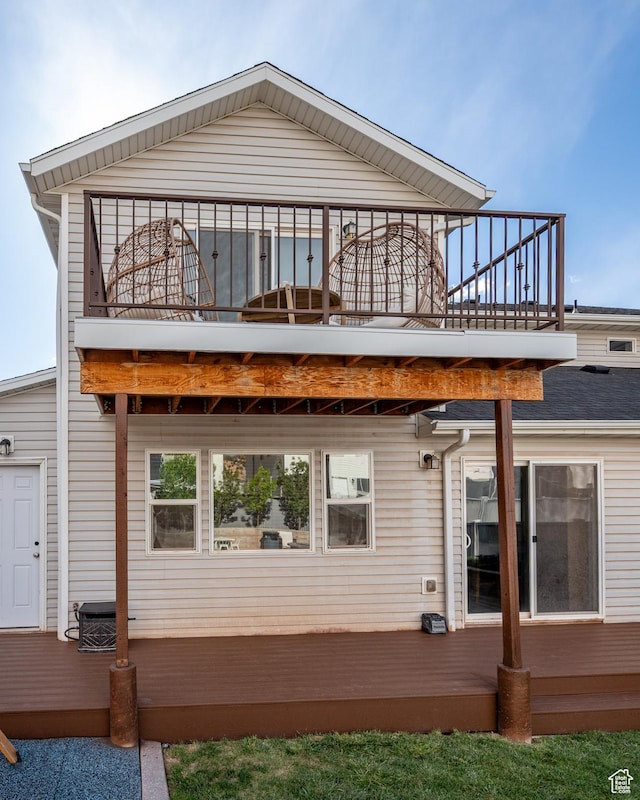 rear view of house with a balcony