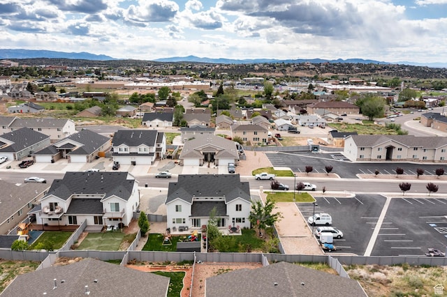 aerial view of residential area featuring a mountainous background