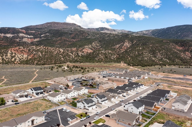 view of mountain background featuring nearby suburban area