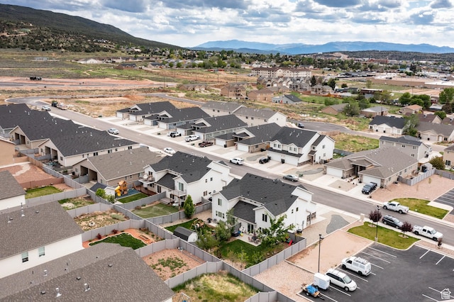 aerial view of residential area featuring mountains