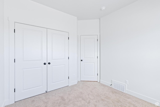 676 E 2450 N, North Logan, UT 84341 - unfurnished bedroom featuring carpet floors, a closet, and baseboards