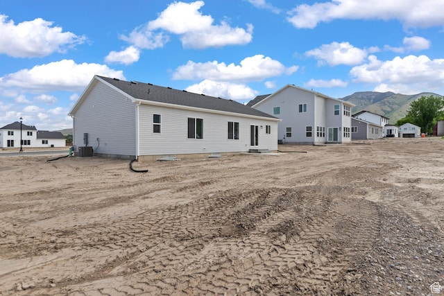 676 E 2450 N, North Logan, UT 84341 - back of property featuring a mountain view and cooling unit