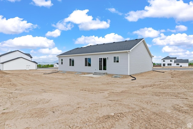676 E 2450 N, North Logan, UT 84341 - back of house featuring roof with shingles