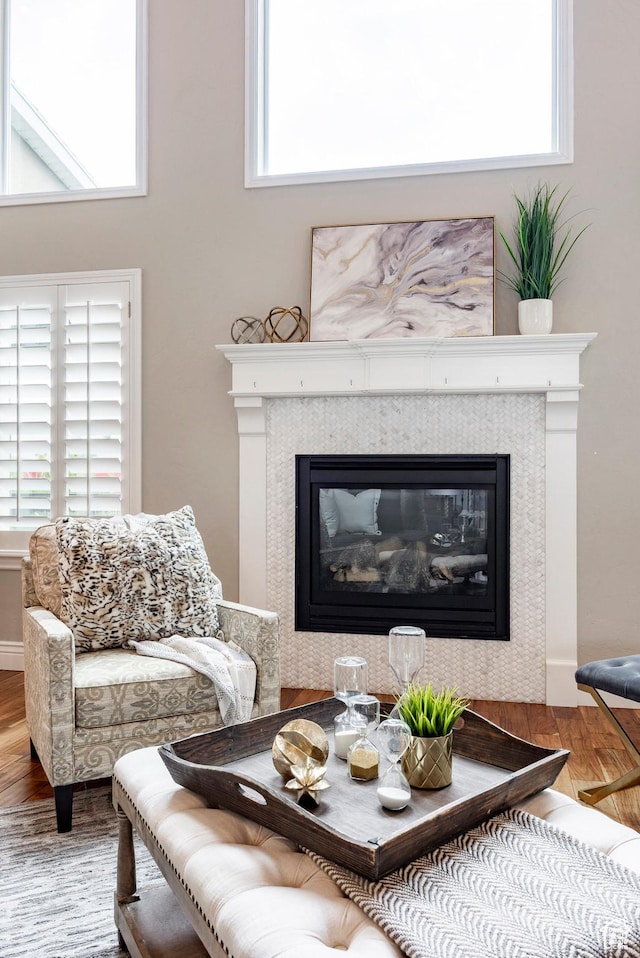 1309 W Atrium Ct W, Farmington, UT 84025 - living area featuring wood finished floors, a fireplace, and plenty of natural light
