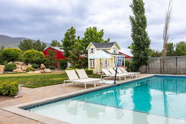 1309 W Atrium Ct W, Farmington, UT 84025 - view of pool featuring a storage structure, fence, an outbuilding, and a patio
