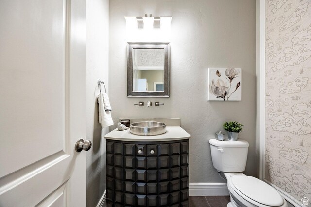 1309 W Atrium Ct W, Farmington, UT 84025 - bathroom with toilet, baseboards, vanity, and tile patterned floors