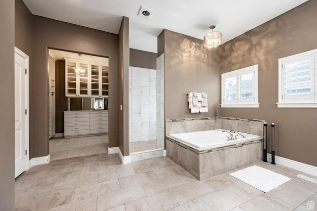 1309 W Atrium Ct W, Farmington, UT 84025 - bathroom with a tile shower, a bath, a chandelier, and baseboards