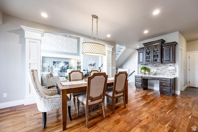 1309 W Atrium Ct W, Farmington, UT 84025 - dining space featuring wood finished floors, recessed lighting, stairway, and baseboards