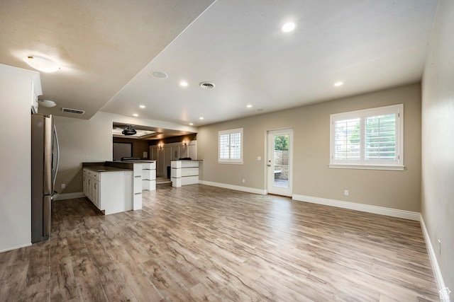 1309 W Atrium Ct W, Farmington, UT 84025 - kitchen featuring freestanding refrigerator, open floor plan, wood finished floors, baseboards, and recessed lighting