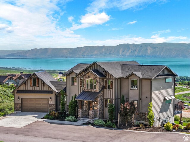 68 Hawksbeard Cir, Fish Haven, ID 83287 - craftsman inspired home with board and batten siding, stone siding, a water and mountain view, and concrete driveway