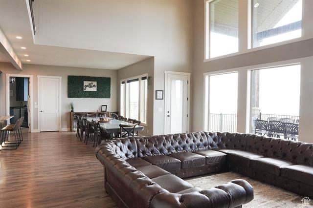 68 Hawksbeard Cir, Fish Haven, ID 83287 - living area with a towering ceiling, wood finished floors, healthy amount of natural light, recessed lighting, and baseboards