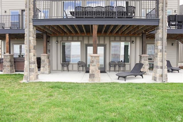 68 Hawksbeard Cir, Fish Haven, ID 83287 - back of property featuring a patio, a balcony, and a yard