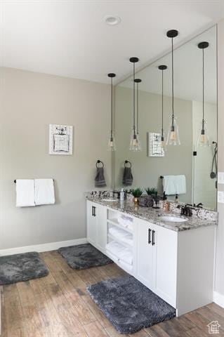 68 Hawksbeard Cir, Fish Haven, ID 83287 - full bath with wood finished floors, double vanity, and baseboards