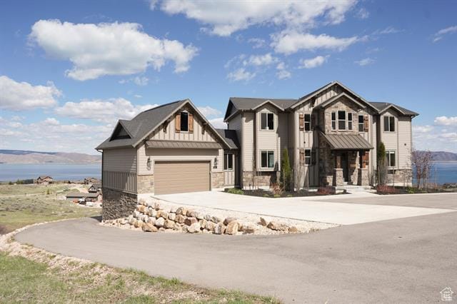 68 Hawksbeard Cir, Fish Haven, ID 83287 - craftsman house with stone siding, board and batten siding, concrete driveway, and a water view