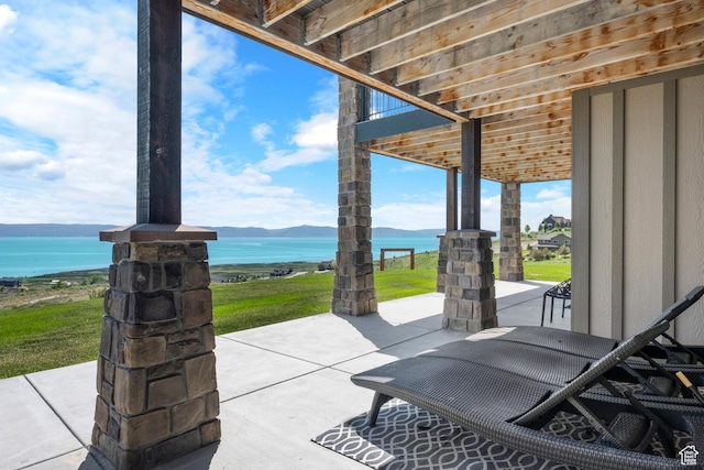 68 Hawksbeard Cir, Fish Haven, ID 83287 - view of patio / terrace featuring a water and mountain view